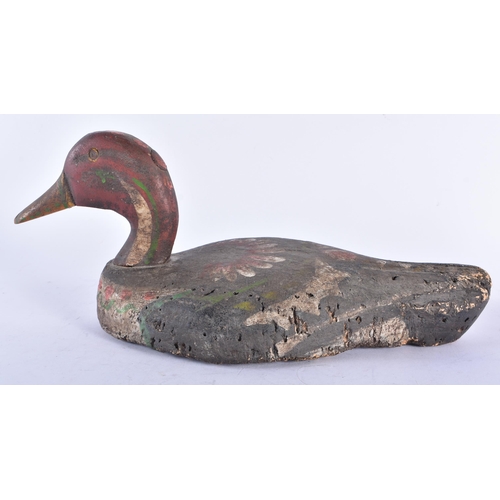 573 - AN EARLY SCANDINAVIAN FOLK ART PAINTED WOOD DUCK DECOY. 32 cm long.