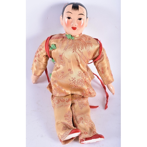 580 - AN UNUSUAL KOREAN CARVED AND PAINTED WOOD MASK PANEL together with a Chinese doll. Largest 36 cm x 2... 