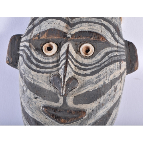 583 - AN UNUSUAL PAPUA NEW GUINEA SEPIK RIVER CARVED WOOD TRIBAL FIGURE with painted features. 48 cm x 20 ... 