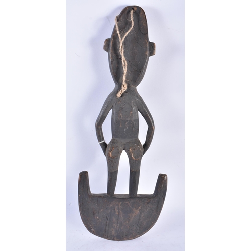 583 - AN UNUSUAL PAPUA NEW GUINEA SEPIK RIVER CARVED WOOD TRIBAL FIGURE with painted features. 48 cm x 20 ... 