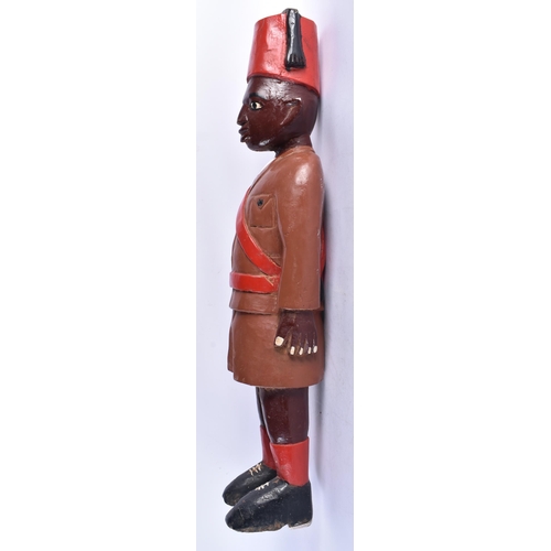 586 - AN UNUSUAL AFRICAN TRIBAL CARVED AND PAINTED WOODEN MAN. 80 cm high.