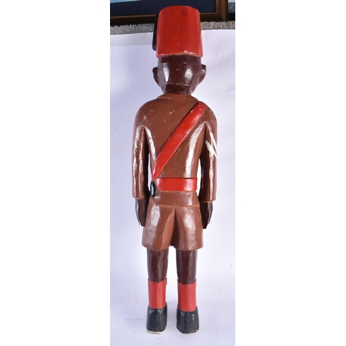 586 - AN UNUSUAL AFRICAN TRIBAL CARVED AND PAINTED WOODEN MAN. 80 cm high.