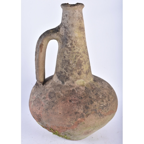 587 - AN UNUSUAL EARLY TERRACOTTA JUG After the Antiquity. 40 cm high.