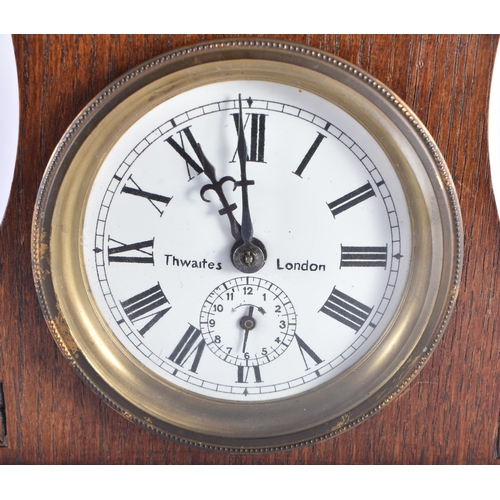 70 - AN ANTIQUE THWAITES OF LONDON GLOBE CLOCK formed within a brass casing, over an oak case containing ... 