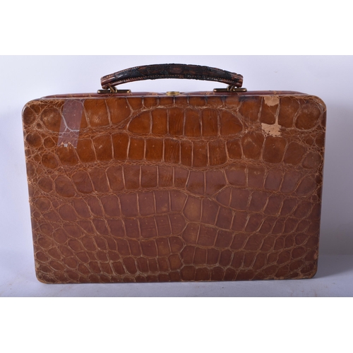 80 - AN ANTIQUE ENGLISH CROCODILE SKIN JEWELLERY BOX together with three leather cases & a cased gaming s... 