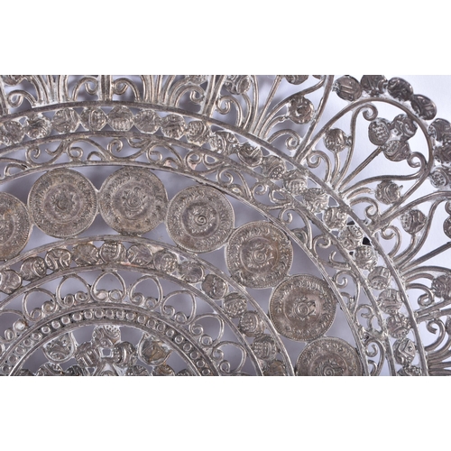 95 - AN ANTIQUE INDIAN WHITE METAL FILIGREE COIN DISH. 322 grams. 20 cm wide.