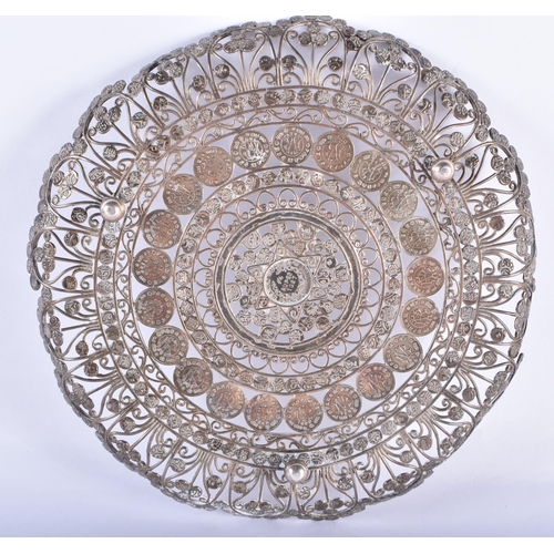 95 - AN ANTIQUE INDIAN WHITE METAL FILIGREE COIN DISH. 322 grams. 20 cm wide.