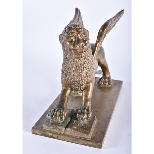 1001 - A FINE 18TH CENTURY EUROPEAN BRONZE FIGURE OF THE LION OF SAINT MARK beautifully modelled upon a rec... 