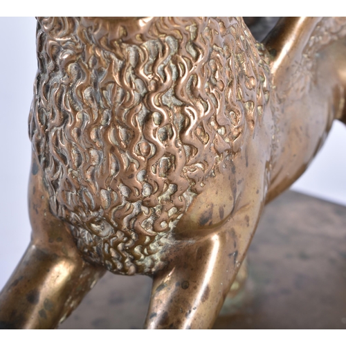 1001 - A FINE 18TH CENTURY EUROPEAN BRONZE FIGURE OF THE LION OF SAINT MARK beautifully modelled upon a rec... 