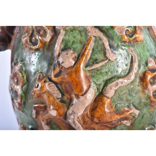 1004 - A RARE CHINESE TANG DYNASTY SANCAI GLAZED PHOENIX AND EQUESTRIAN EWER decorated in relief with arche... 