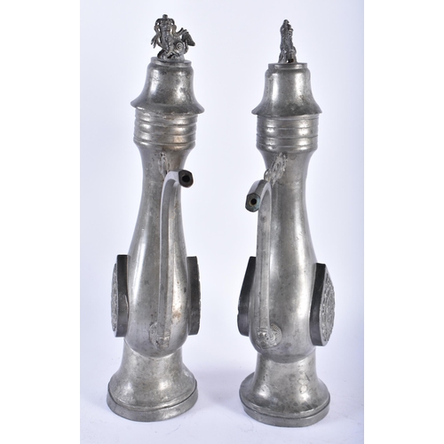 1005 - AN UNUSUAL PAIR OF 19TH CENTURY CHINESE PEWTER EWERS Qing, decorated with a buddhistic emblem. 34 cm... 