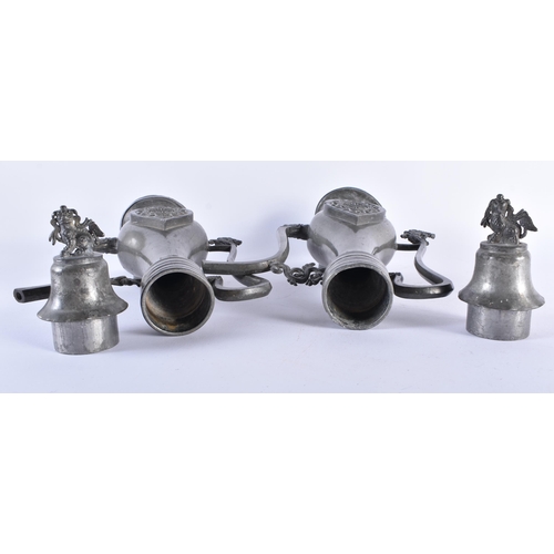 1005 - AN UNUSUAL PAIR OF 19TH CENTURY CHINESE PEWTER EWERS Qing, decorated with a buddhistic emblem. 34 cm... 