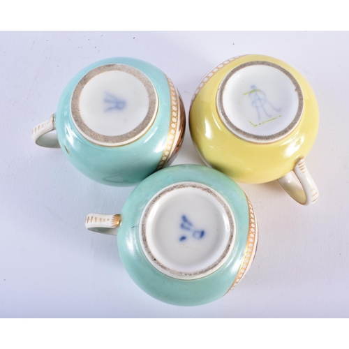 1011 - TWO 19TH CENTURY GERMAN AUGUSTUS REX PORCELAIN CHOCOLATE CUPS AND SAUCERS together with a similar cu... 