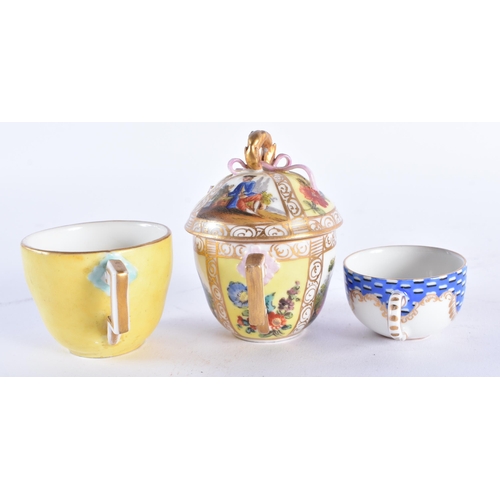 1012 - A 19TH CENTURY GERMAN PORCELAIN CUP AND SAUCER together with an Augustus Rex cup and saucer & a simi... 