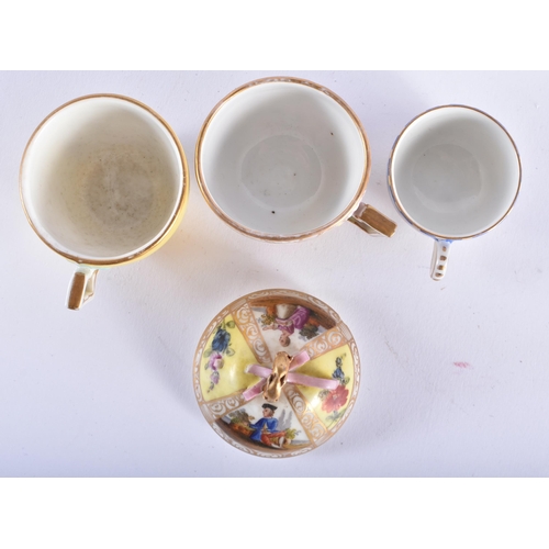 1012 - A 19TH CENTURY GERMAN PORCELAIN CUP AND SAUCER together with an Augustus Rex cup and saucer & a simi... 