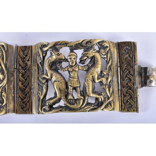 1032 - AN 18TH CENTURY CONTINENTAL BRONZE BRACELET decorated with figures in various pursuits. 18 cm wide.