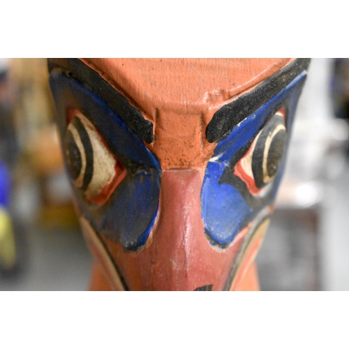 604 - A NORTH AMERICAN PAINTED WOOD TOTEM POLE. 100 cm x 60 cm.