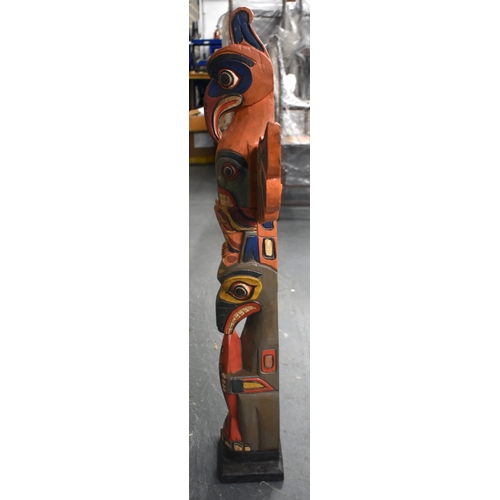 604 - A NORTH AMERICAN PAINTED WOOD TOTEM POLE. 100 cm x 60 cm.