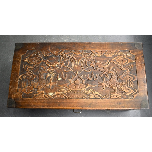 607 - A LATE 19TH/20TH CENTURY CHINESE CARVED WOOD DRAGON CHEST Late Qing. 85 cm x 45 cm.