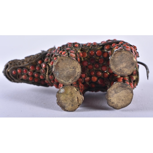 610 - AN ANTIQUE TIBETAN BRASS AND CORAL RHINOCEROS. 8 cm wide.