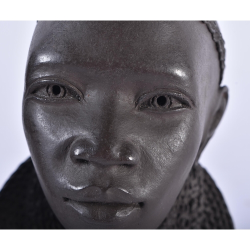 614 - A PAIR OF AFRICAN KENYAN CERAMIC BUSTS OF A MAASAI LADY AND GENTLEMAN by Apollo. 13 cm high.