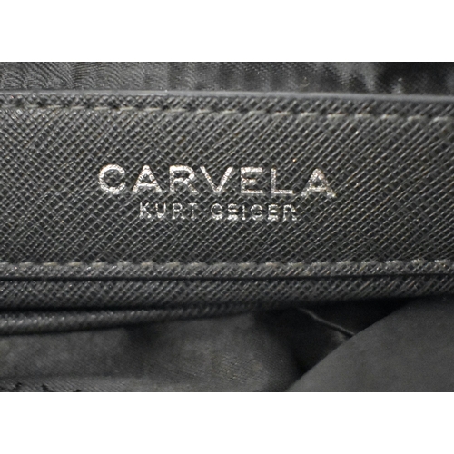 618 - THREE DESIGNER CARVELLA LEATHER HANDBAGS. (3)