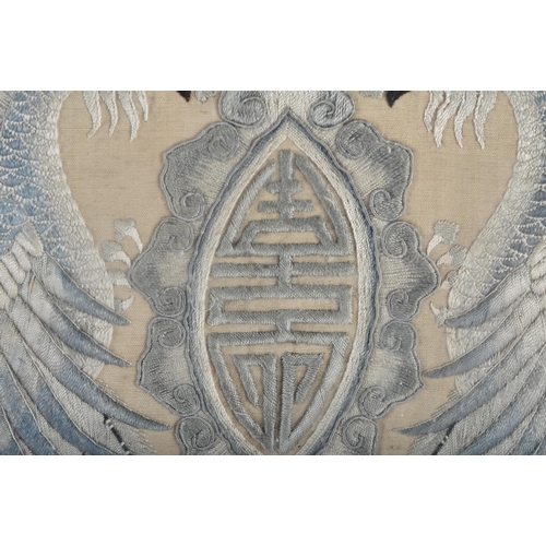 622 - A 19TH CENTURY CHINESE FRAMED AND EMBROIDERED DOUBLE BIRD PANEL Qing. 66 cm square.