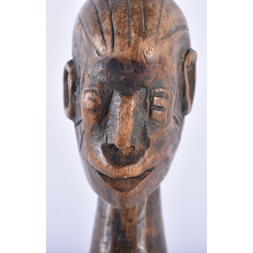 624 - AN AFRICAN TRIBAL CARVED WOOD FERTILITY PULLEY. 24 cm high.