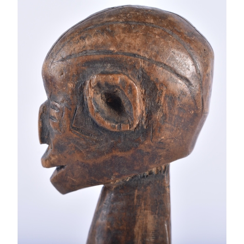 624 - AN AFRICAN TRIBAL CARVED WOOD FERTILITY PULLEY. 24 cm high.