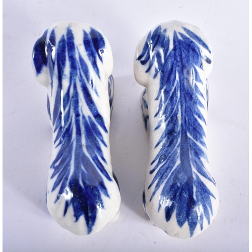 632 - AN UNUSUAL PAIR OF ANTIQUE BLUE AND WHITE SALT GLAZED KNIFE RESTS. 6.5 cm wide.