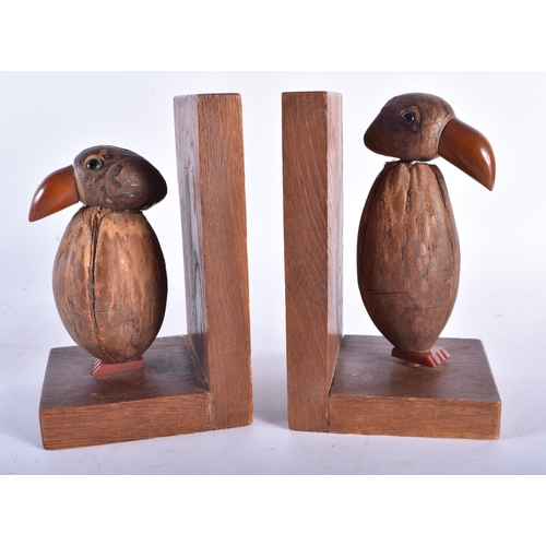 633 - A RARE PAIR OF ART DECO CARVED COCONUT AND BAKELITE AMBER TYPE BOOKENDS. Each 15 cm x 9 cm.