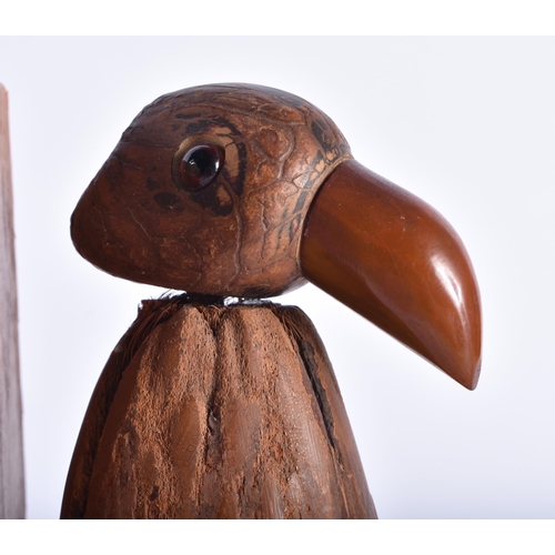 633 - A RARE PAIR OF ART DECO CARVED COCONUT AND BAKELITE AMBER TYPE BOOKENDS. Each 15 cm x 9 cm.