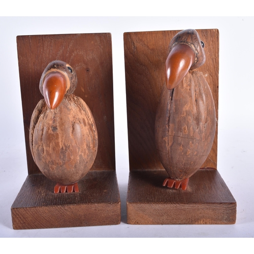 633 - A RARE PAIR OF ART DECO CARVED COCONUT AND BAKELITE AMBER TYPE BOOKENDS. Each 15 cm x 9 cm.