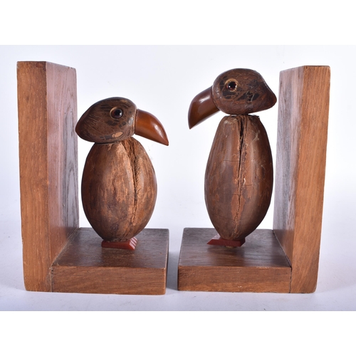 633 - A RARE PAIR OF ART DECO CARVED COCONUT AND BAKELITE AMBER TYPE BOOKENDS. Each 15 cm x 9 cm.