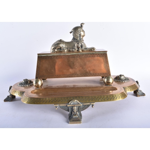 636 - A LOVELY LARGE 19TH CENTURY ENGLISH EGYPTIAN REVIVAL DESK STAND formed with a recumbent sphinx, upon... 