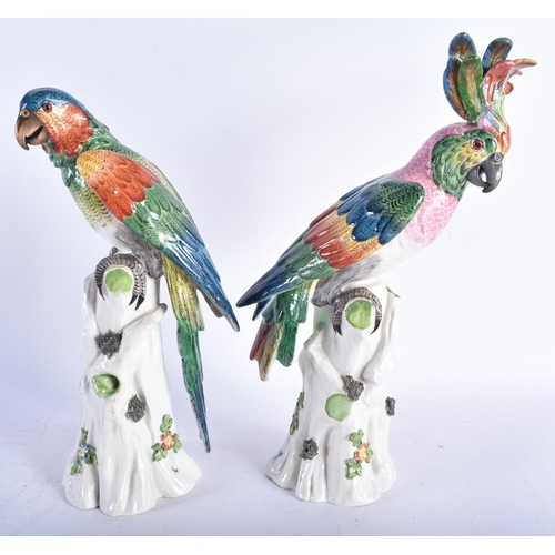 639 - A LOVELY PAIR OF 19TH CENTURY GERMAN PORCELAIN FIGURES OF PARROTS modelled with brightly coloured pl... 