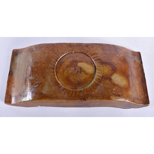 640 - AN EARLY CHINESE YELLOW GLAZED CERAMIC DISH Ming/Qing, possibly a brush washer or wrist rest. 24 cm ... 