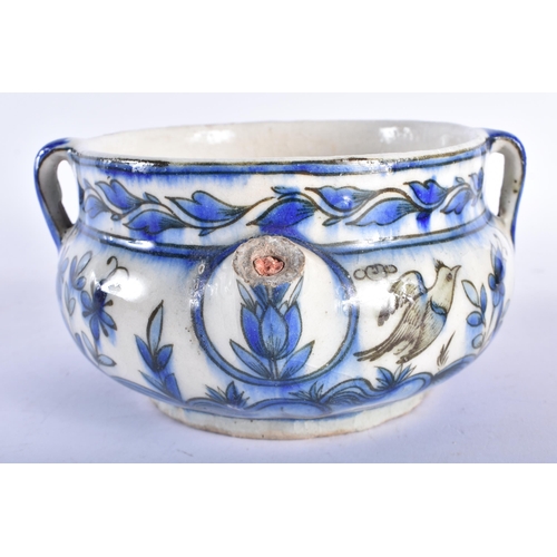 658 - A RARE 18TH CENTURY MIDDLE EASTERN SAFAVID POURING BOWL with three loop handles, painted with birds ... 