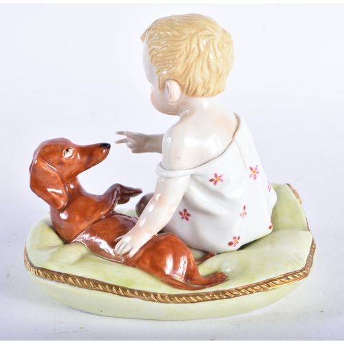 663 - AN UNUSUAL ANTIQUE GERMAN PORCELAIN FIGURE OF A YOUNG CHILD modelled playing with a dog. 10 cm x 10 ... 