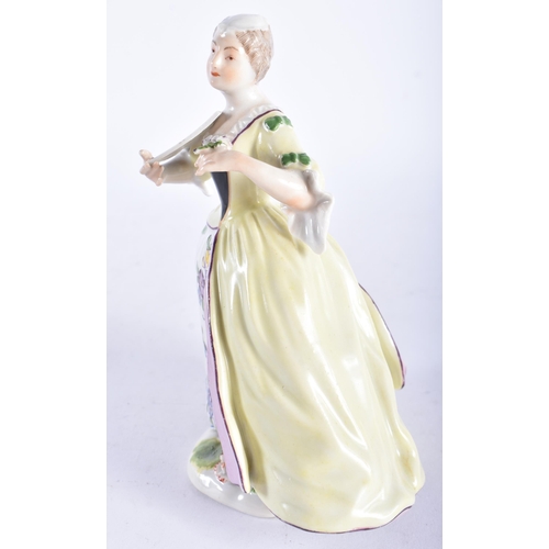 664 - A 19TH CENTURY GERMAN PORCELAIN FIGURE OF A LADY modelled wearing a dress painted with flowers. 15 c... 