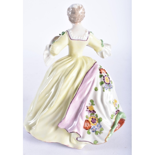 664 - A 19TH CENTURY GERMAN PORCELAIN FIGURE OF A LADY modelled wearing a dress painted with flowers. 15 c... 