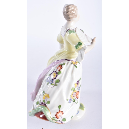 664 - A 19TH CENTURY GERMAN PORCELAIN FIGURE OF A LADY modelled wearing a dress painted with flowers. 15 c... 