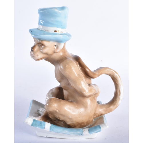 665 - A RARE 19TH CENTURY CONTINENTAL PORCELAIN CHAMBERSTICK modelled as a seated monkey wearing a top hat... 