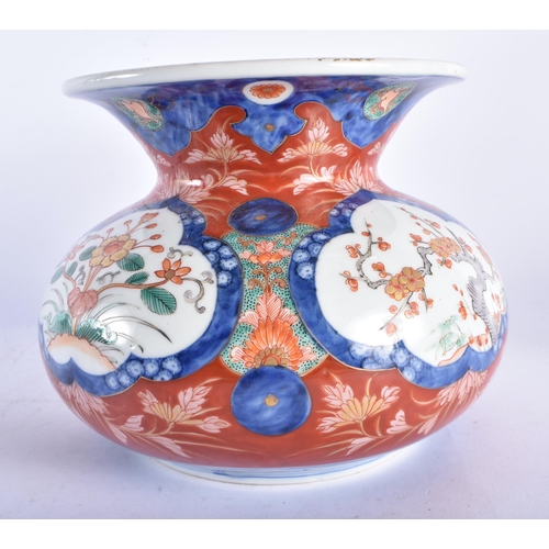 669 - AN UNUSUAL 19TH CENTURY JAPANESE MEIJI PERIOD IMARI SPITTOON VASE painted with foliage. 18 cm x 18 c... 