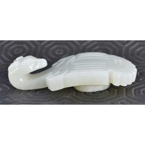 676 - A 19TH CENTURY CHINESE CARVED GREENISH WHITE JADE BELT HOOK Late Qing. 6.5 cm x 3.5 cm.