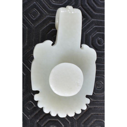 676 - A 19TH CENTURY CHINESE CARVED GREENISH WHITE JADE BELT HOOK Late Qing. 6.5 cm x 3.5 cm.