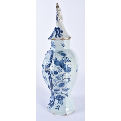 698 - AN 18TH CENTURY DUTCH DELFT BLUE AND WHITE POTTERY VASE AND COVER painted with vases of flowers. 36 ... 