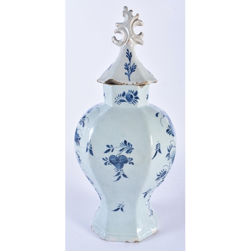 698 - AN 18TH CENTURY DUTCH DELFT BLUE AND WHITE POTTERY VASE AND COVER painted with vases of flowers. 36 ... 