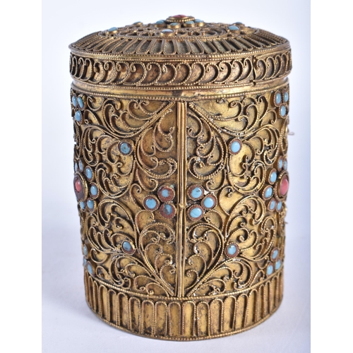 705 - AN ANTIQUE TIBETAN YELLOW METAL FILIGREE BOX AND COVER inset with jewelled turquoise and coral. 9.5 ... 