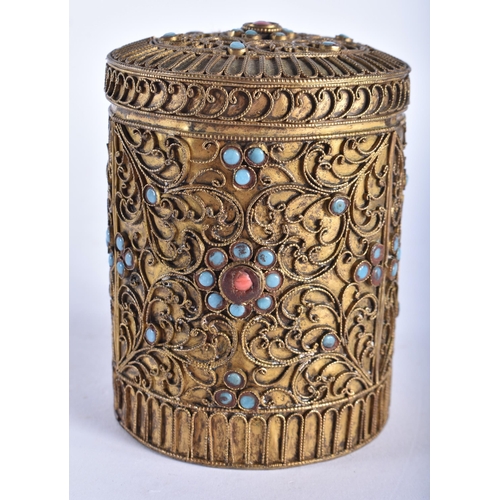 705 - AN ANTIQUE TIBETAN YELLOW METAL FILIGREE BOX AND COVER inset with jewelled turquoise and coral. 9.5 ... 